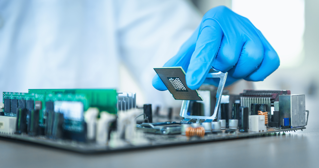 Photo of a lab technician working on electronic data port inserting a chip