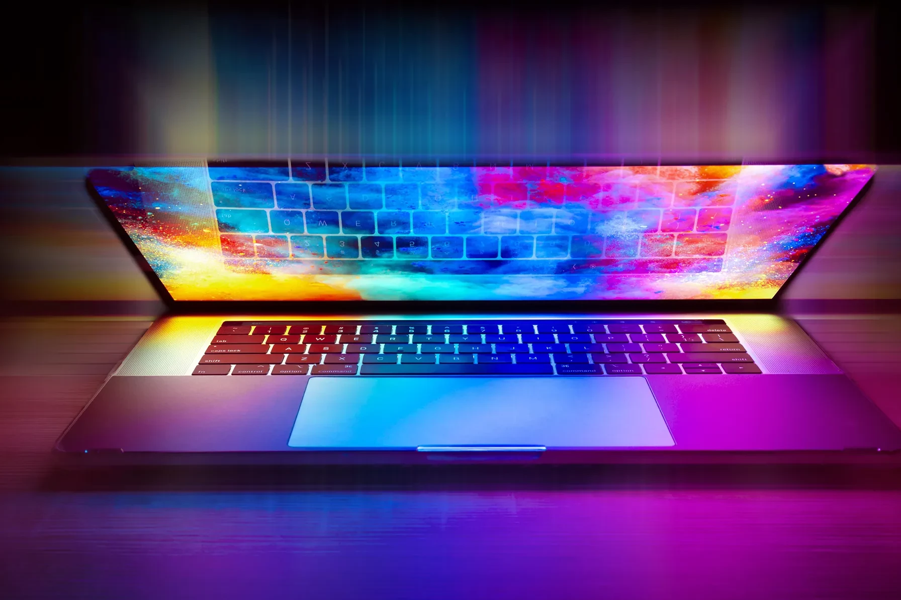 Photo of a laptop have closed over, with the reflection of the screen creating a vibrant after effect