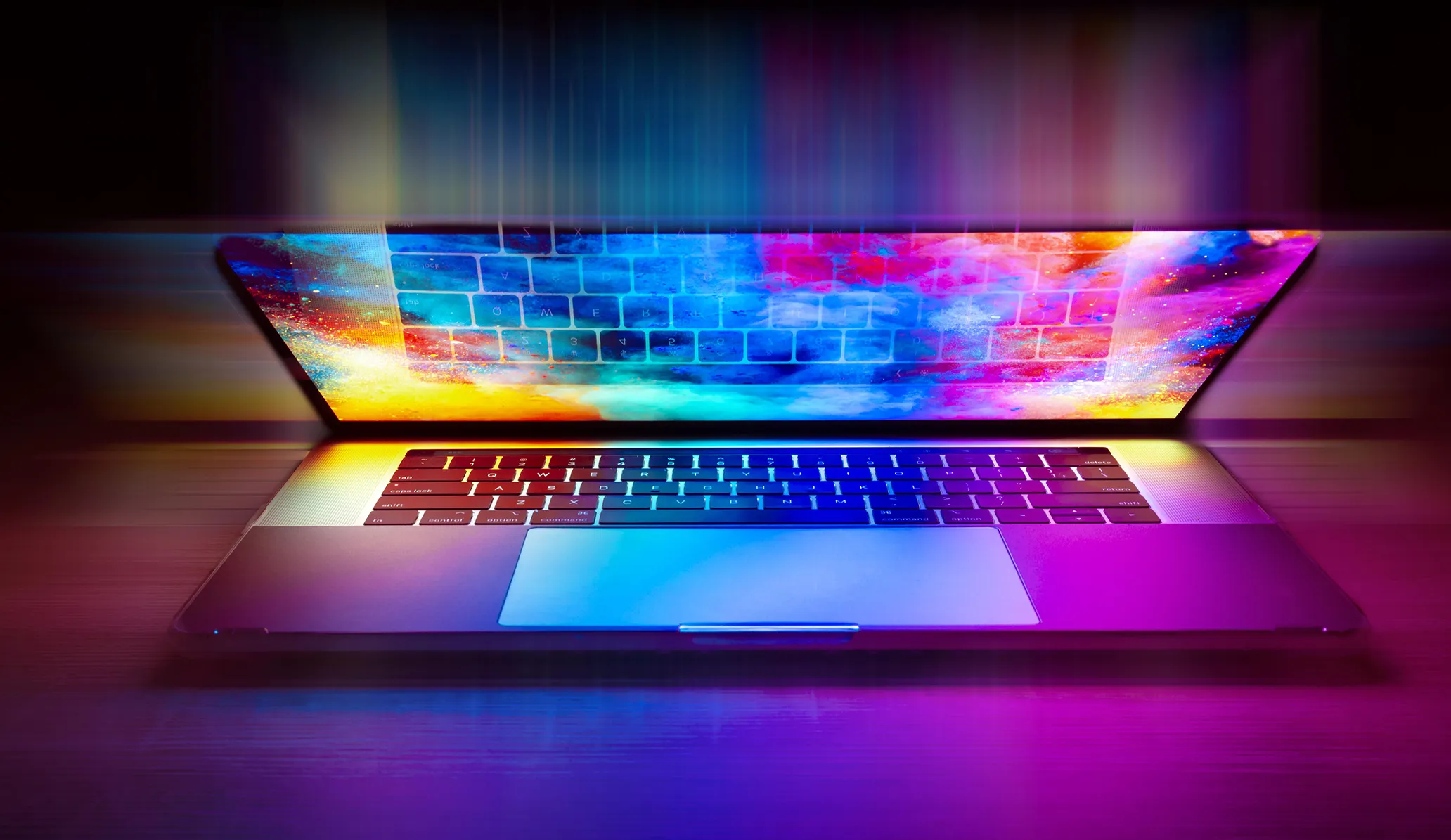 Photo of a laptop have closed over, with the reflection of the screen creating a vibrant after effect