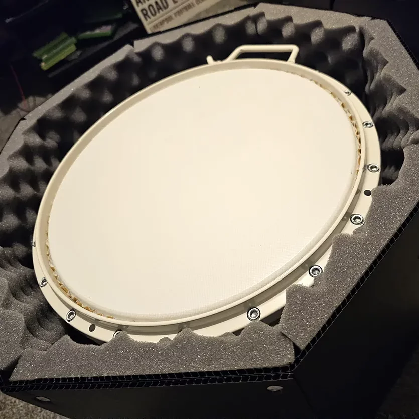 Photo of a drum inside a custom made reusable box