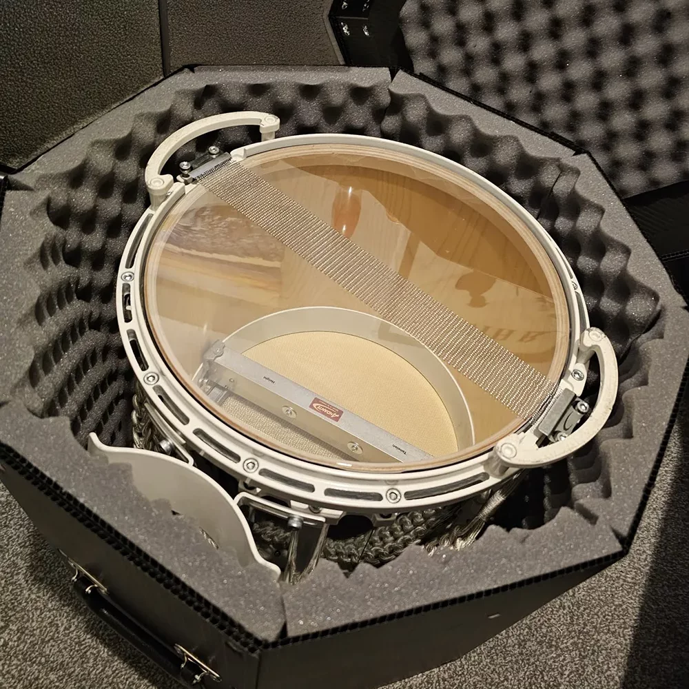 Photo of a drum inside a custom made reusable box