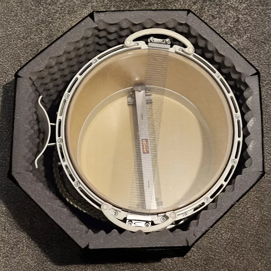 Photo of a drum inside a custom made reusable box